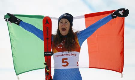Alpine Skiing - Pyeongchang 2018 Winter Olympics - Women's Downhill - Jeongseon Alpine Centre - Pyeongchang, South Korea - February 21, 2018 - Gold medallist Sofia Goggia of Italy celebrates with the Italian flag during the flower ceremony. REUTERS/Leonhard Foeger