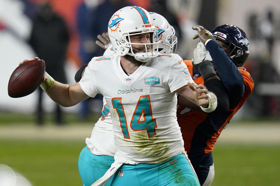 Miami Dolphins quarterback Ryan Fitzpatrick (14) throws against the Denver Broncos during the second half of an NFL football game, Sunday, Nov. 22, 2020, in Denver. The Broncos won 20-13. (AP Photo/David Zalubowski)