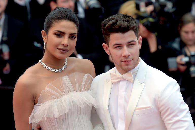 When it comes to everyone’s favourite celebrity couple on Instagram, Nick Jonas and Priyanka Chopra rank highly.The famous duo regularly post loved-up snaps on their respective social media feeds, much to the delight of their legions of fans.Now, to celebrate the one-year anniversary of the day they met, Jonas has uploaded a candid photograph of the couple posing on a balcony at Cannes Film Festival, presumably taken before they ventured out onto the event’s star-studded red carpet.Both in white, Jonas is pictured wearing a fitted tuxedo while Chopra donned a bridal-like gown by Lebanese designer Georges Hobeika that boasted copious layers of tulle.Recalling the day they met in the image’s caption, Jonas wrote: “One year ago today I went to go see Beauty and the Beast at the Hollywood Bowl with a group of friends."One of those friends was the woman that would become my best friend, my confidant, my muse, my beautiful wife. I am so grateful for our journey together so far.”> View this post on Instagram> > One year ago today I went to go see Beauty and the Beast at the Hollywood bowl with a group of friends. One of those friends was the woman that would become my best friend, my confidant, my muse, my beautiful wife. I am so grateful for our journey together so far. You make me smile every day and you inspire me to be the best version of myself. I am honored to be your husband. I love you. ❤️ @priyankachopra> > A post shared by Nick Jonas (@nickjonas) on May 25, 2019 at 11:41am PDTThe singer added that Chopra makes him smile “every day”.“I am honoured to be your husband,” he concluded, “I love you.”The post, which Jonas uploaded on Sunday, has already garnered more than 3.2 million likes and thousands of comments congratulating the couple on the milestone.“All the men, take note of Nick Jonas,” wrote one fan.“Hollywood and regular people in general need more of this positive love model,” added another. The couple tied the knot in two ceremonies in December.> View this post on Instagram> > The best husband ever...A lambily member’s dream came true...Even though he was busy and we were apart, he made sure I celebrated our one year anniversary with my fave! The incomparable @mariahcarey Mimi — you were amazing! So lovely meeting you and thank you for the incredible show...you will always be my baby @nickjonas Happy one year love! @fchhara thx for being my date! So fun! mimi meets mimi wearing @mimi> > A post shared by Priyanka Chopra Jonas (@priyankachopra) on May 25, 2019 at 5:32pm PDTChopra also posted a special dedication to her husband on Instagram, revealing that the duo were apart for their anniversary, but that he had surprised her with tickets to see Mariah Carey in concert in London.“The best husband ever,” the actor wrote. “A lambily member’s dream came true...Even though he was busy and we were apart, he made sure I celebrated our one year anniversary with my fave. You will always be my baby @nickjonas.”