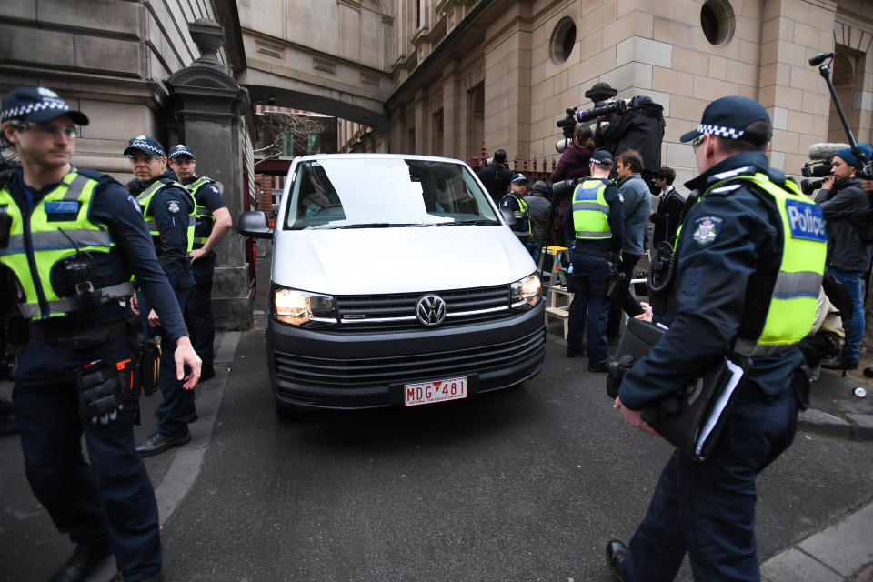 Cardinal Pell arrives under heavy police guard at the Supreme Court. Source: AAP