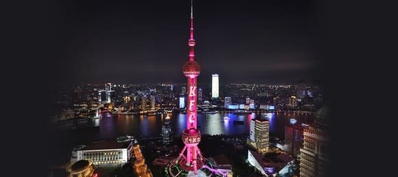 Shanghai skyline celebrating the year year anniversary of KFC in China by putting the brand's logo on its Pearl Tower.