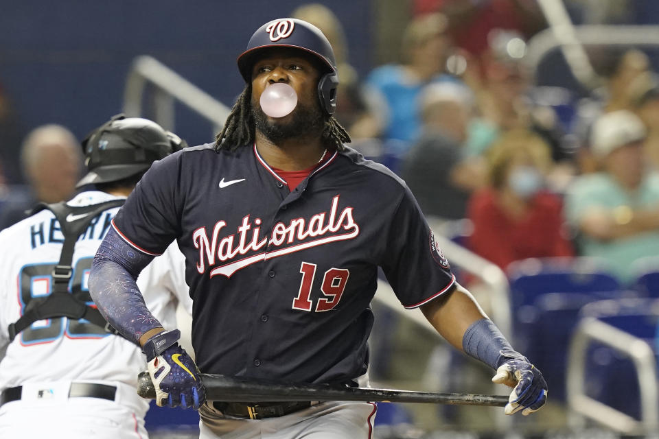 Washington Nationals' Josh Bell (19) blows a bubble after striking out in the second inning of a baseball game against the Miami Marlins, Monday, Sept. 20, 2021, in Miami. (AP Photo/Marta Lavandier)