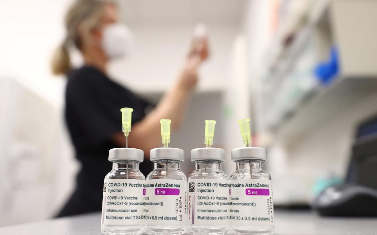 A healthcare worker prepares a shot of the Oxford-AstraZenea coronavirus vaccine - Reuters/KAI PFAFFENBACH 