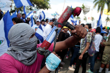 A protester poses with his homemade mortar during a protest against President Daniel Ortega's government in Managua, Nicaragua May 30, 2018. REUTERS/Oswaldo Rivas