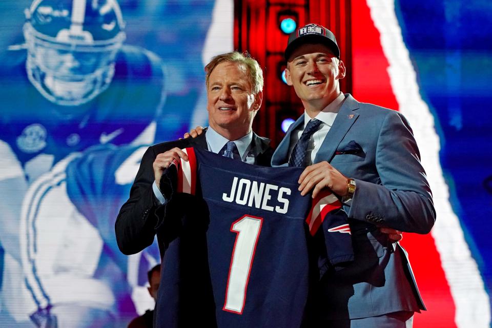 Mac Jones poses with NFL commissioner Roger Goodell after the Alabama quarterback was selected in the first round, 15th overall, of the draft by the Patriots last April.