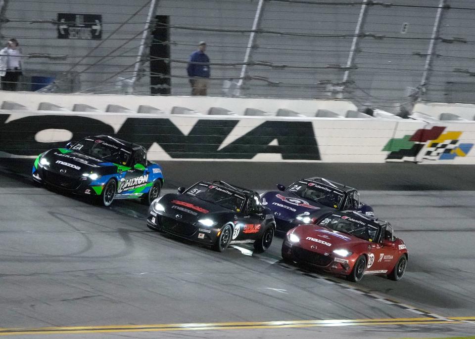 Tyler Gonzalez (51) wins the race to the finish line during Mazda MX-5 Cup race one at Daytona International Speedway, Thursday, Jan. 26, 2023.