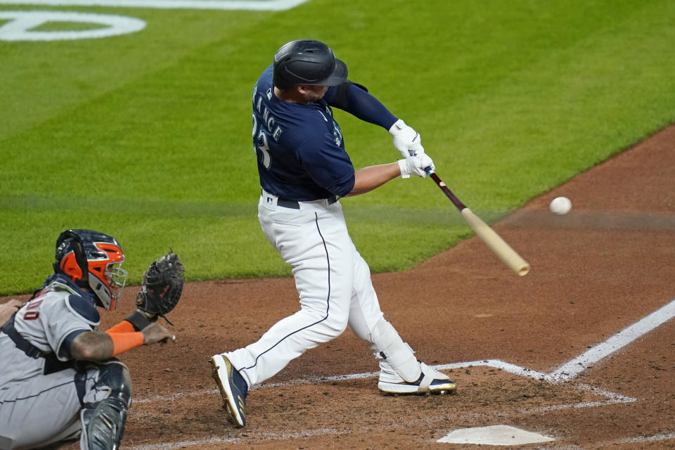 Seattle Mariners' Ty France doubles in a run against the Houston Astros in the seventh inning of a baseball game Monday, Sept. 21, 2020, in Seattle. (AP Photo/Elaine Thompson)