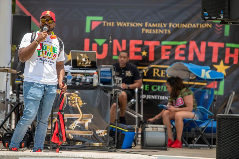 Aaron Watson, Esq, speaks to the crowd during Juneteenth A Family Reunion For The Culture at Museum Plaza Saturday, June 18, 2022. The celebration included, live music, food, games and more.