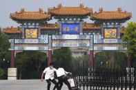 Security guards pull a barrier into the Tianjin Binhai No. 1 Hotel where U.S. and Chinese officials are expected to hold talks in Tianjin municipality in China Monday, July 26, 2021. America's No. 2 diplomat has arrived in China to discuss the fraught relationship between the two countries on Monday with two top Foreign Ministry officials. (AP Photo/Ng Han Guan)