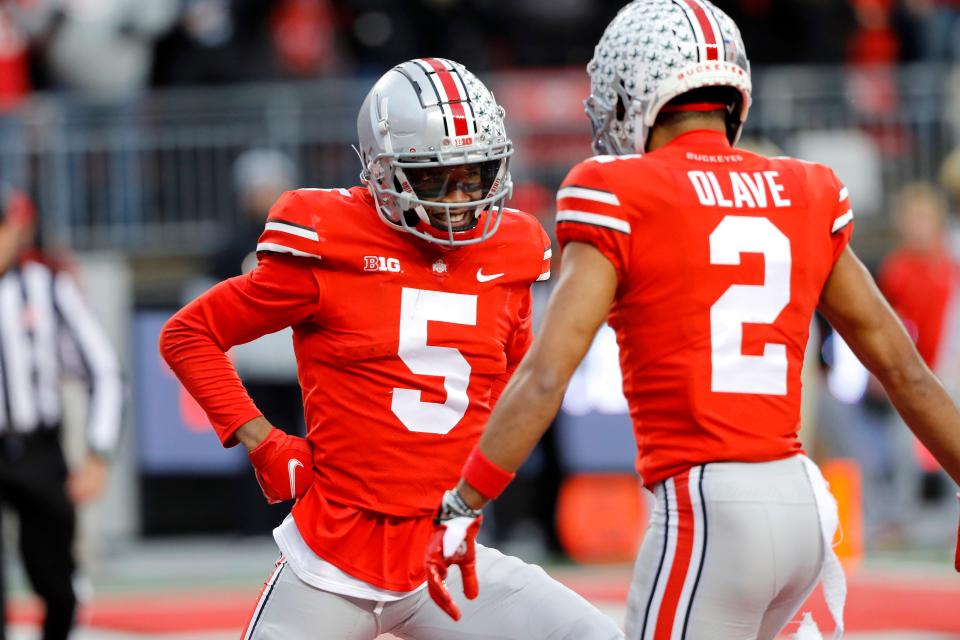 With wide receiver being an obvious position of need, Ohio State's Garrett Wilson, left, and Chris Olave are both potential targets. Wilson has been projected by some experts to be the Browns' pick at No. 13 overall but other experts expect  him to be drafted earlier.