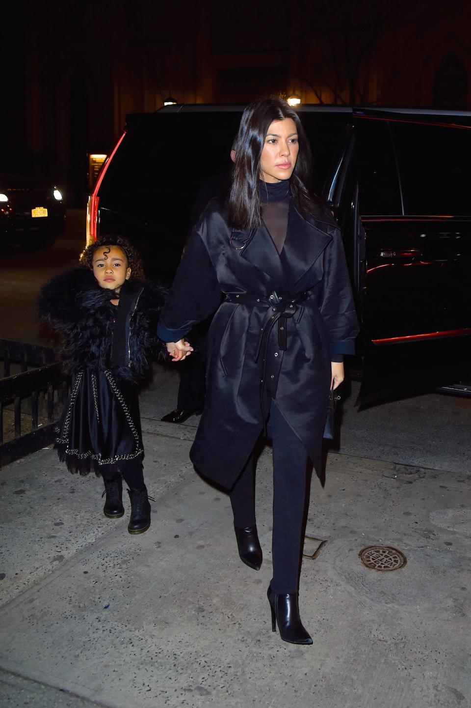 <p>West served an all-black getup, finished with a fur coat and combat boots.</p>