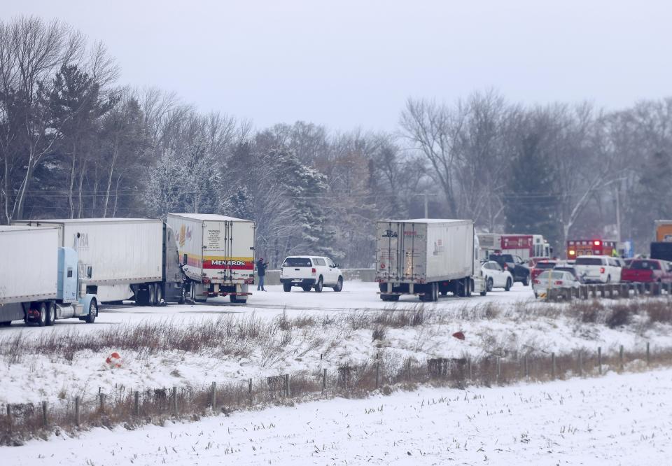 Emergency crews respond to a multi-vehicle accident in both the north and south lanes of Interstate 39/90 on Friday, Jan. 27, 2023 in Turtle, Wis. Authorities say snowy conditions led to a massive traffic pile-up in southern Wisconsin on Friday that left Interstate 39/90 blocked for hours. (Anthony Wahl/The Janesville Gazette via AP)