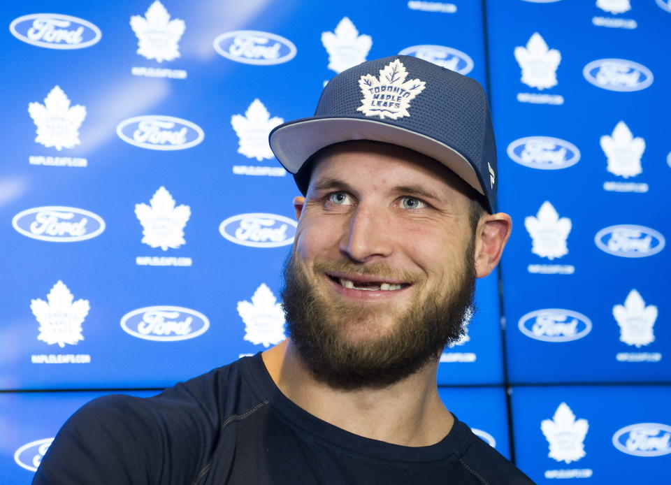 FILE - In this Feb. 6, 2020 file photo, Toronto Maple Leafs new forward Kyle Clifford speaks to the media during an NHL hockey press conference in Toronto. NHL players are debating the merits of quarantining away from family members as part of a potential resumption of the season. Clifford says guaranteeing family time is a ‘hot topic’ among players these days. (Nathan Denette/The Canadian Press via AP)