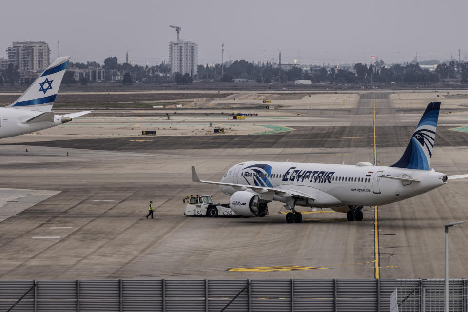 An EgyptAir Airbus 320 aircraft is seen on the tarmac at Ben Gurion International Airport in Lod, Israel, Sunday, Oct. 3, 2021. Egypt's national carrier Sunday made its first official direct flight from Cairo to Israel since the two countries signed an historic 1979 peace treaty as an EgyptAir jet landed at Tel Aviv's Ben Gurion Airport. (AP Photo/Tsafrir Abayov)