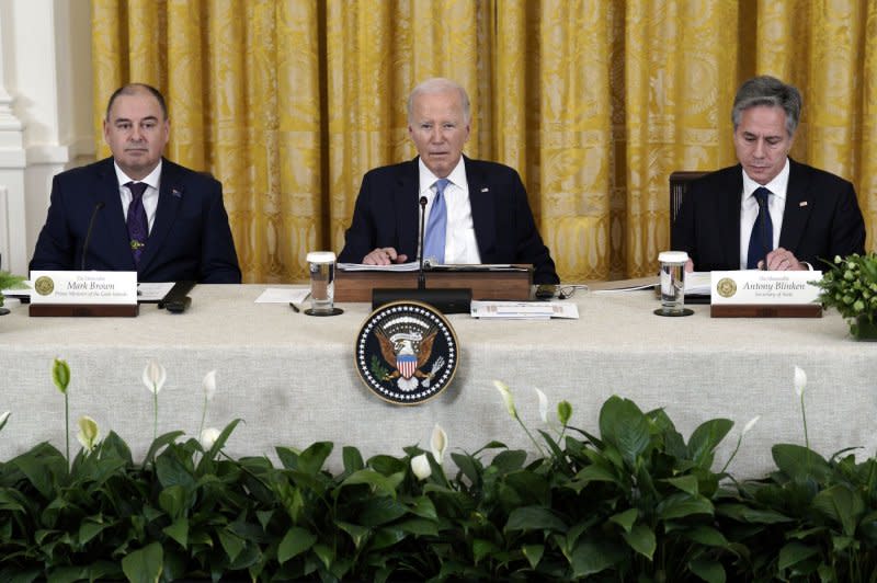 Biden (C) sits with Brown (L) and U.S. Secretary of State Antony Blinken (R). Photo by Yuri Gripas/UPI