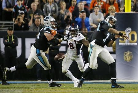 Denver Broncos' Von Miller (58) strips the ball away from Carolina Panthers' quarterback Cam Newton (1) during the fourth quarter of the NFL's Super Bowl 50 football game in Santa Clara, California February 7, 2016. REUTERS/Stephen Lam -