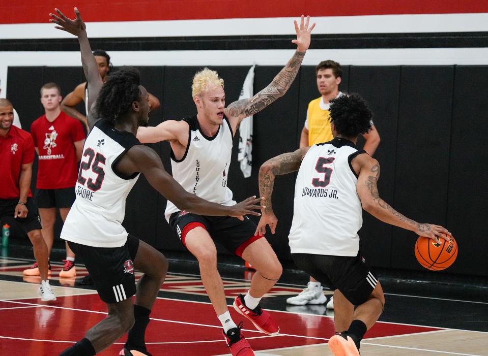 Terrence Edwards Jr drives against Aboubacar Traore and Kasean Pryor during practice before the Cards head to the Bahamas. July 26, 2024