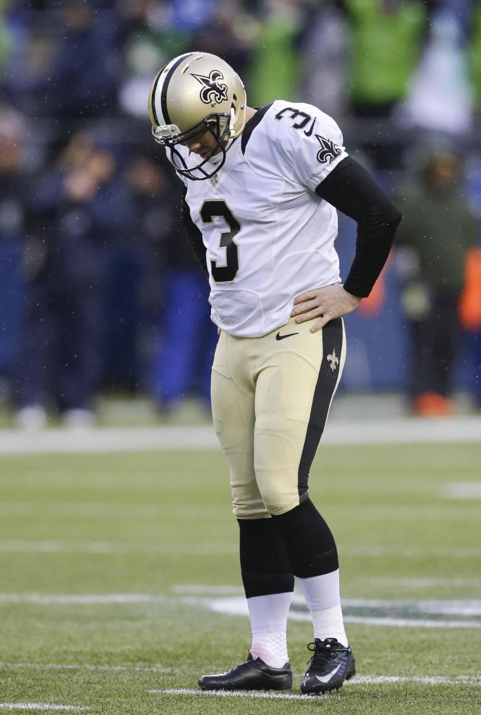 New Orleans Saints' Shayne Graham reacts after missing a 48-yard field goal during the fourth quarter of an NFC divisional playoff NFL football game against the Seattle Seahawks in Seattle, Saturday, Jan. 11, 2014. (AP Photo/Ted S. Warren)