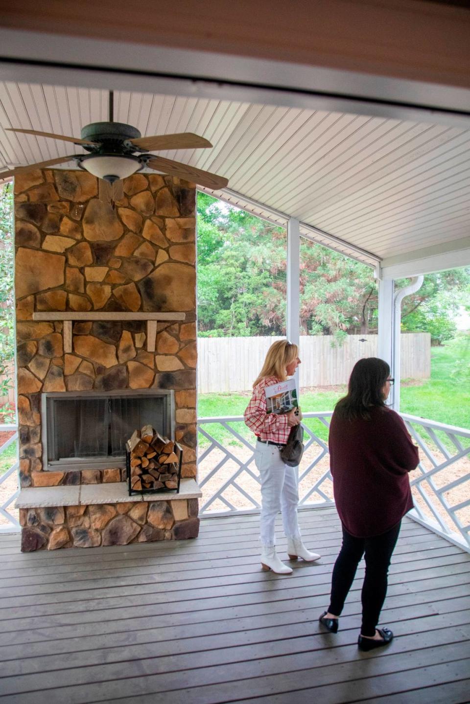 First-time home buyer Carolina Acuipil, right, and Real Estate Broker Colleen Blondell tour a home for sale in Cary on Thursday, April 27, 2023.