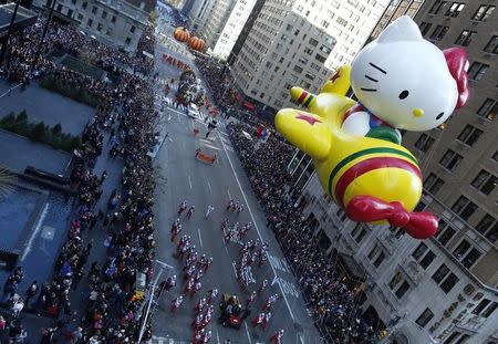 A Hello Kitty balloon float makes its way down 6th Ave during the Macy's Thanksgiving Day Parade in New York, November 22, 2012. REUTERS/Carlo Allegri