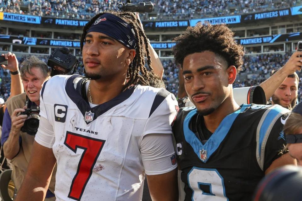 Houston Texans quarterback C.J. Stroud, left, poses with Carolina Panthers quarterback Bryce Young after the game at Bank of America Stadium on Sunday, October 29, 2023. Young and the Panthers got their first win of the season over the Texans, 15-13.