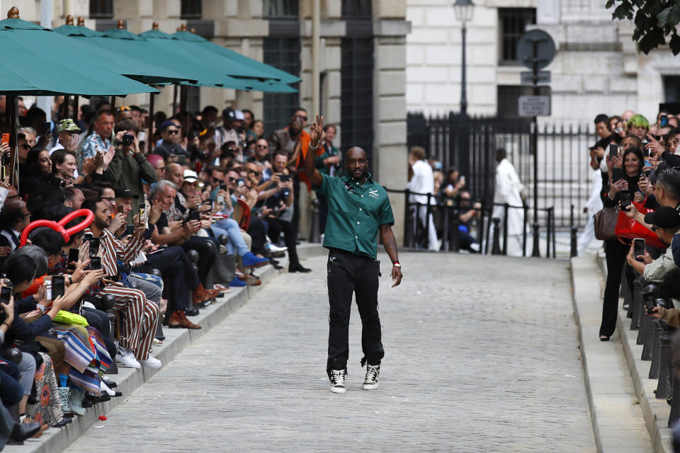 Designer Virgil Abloh accepts applause at the conclusion of the Vuitton mens Spring-Summer 2020 fashion collection presented in Paris, Thursday, June 20. (AP Photo/Francois Mori)