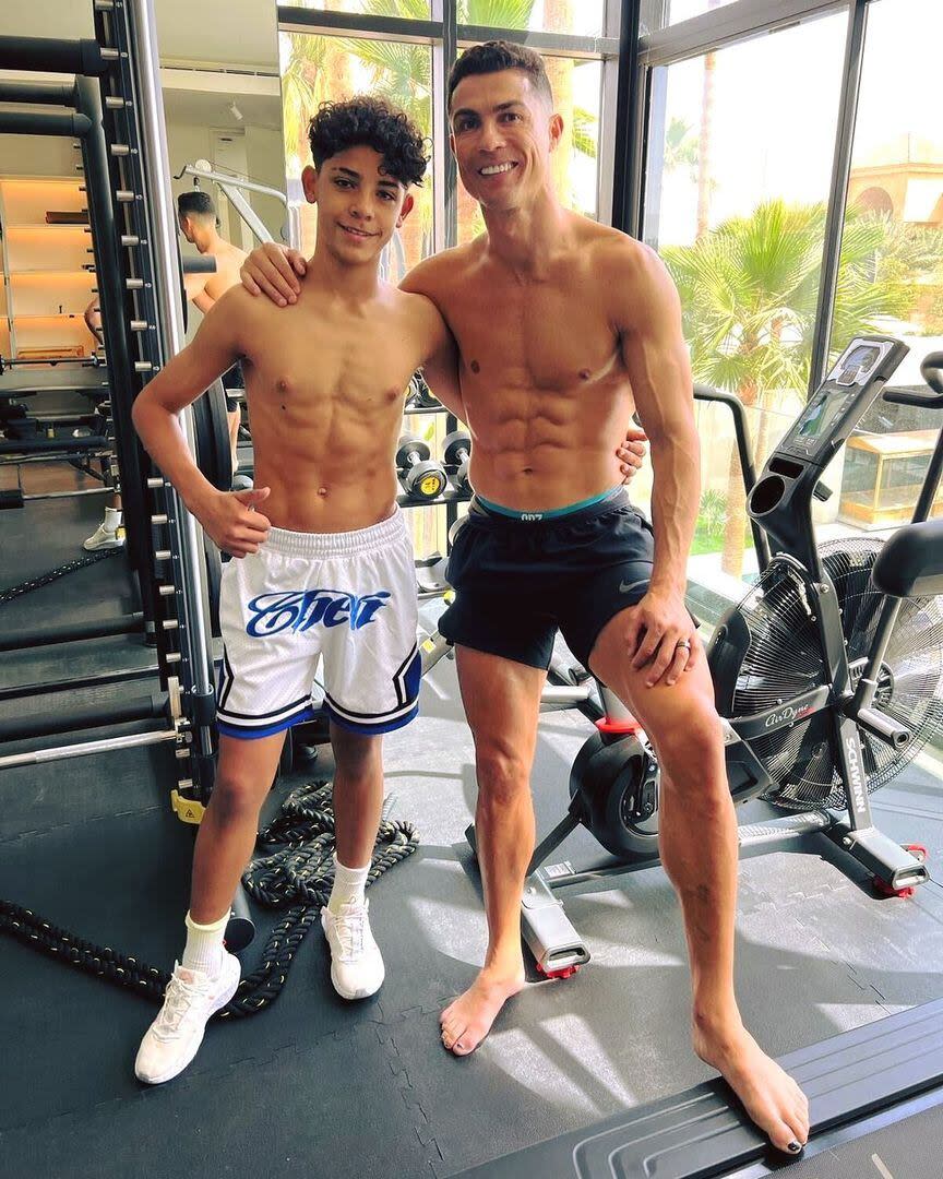 Cristiano and Junior posing in the gym