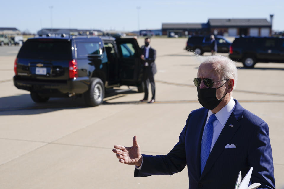 President Joe Biden speaks with members of the press near a waiting motorcade vehicle after stepping off Air Force One at Delaware Air National Guard Base in New Castle, Del., Friday, March 26, 2021. Biden is spending the weekend at his home in Delaware. (AP Photo/Patrick Semansky)