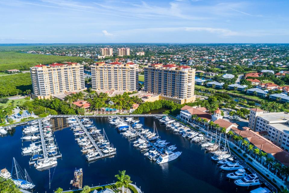 An aerial view of a port with yachts in Cape Coral, Florida.