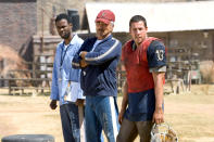 <p>Reynolds returned for the 2005 remake of his hit alongside Adam Sandler and Chris Rock. While Sandler took on the role of Paul Crewe, Reynolds played the inmates’ coach, Nate Scarborough. (Photo: Paramount/courtesy Everett Collection) </p>