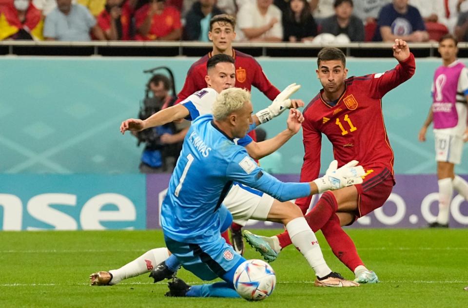 Spain's Ferran Torres, right, scores his side's fourth goal during the World Cup group E football match between Spain and Costa Rica, at the Al Thumama Stadium in Doha, Qatar, Wednesday, Nov. 23, 2022. (AP Photo/Pavel Golovkin)