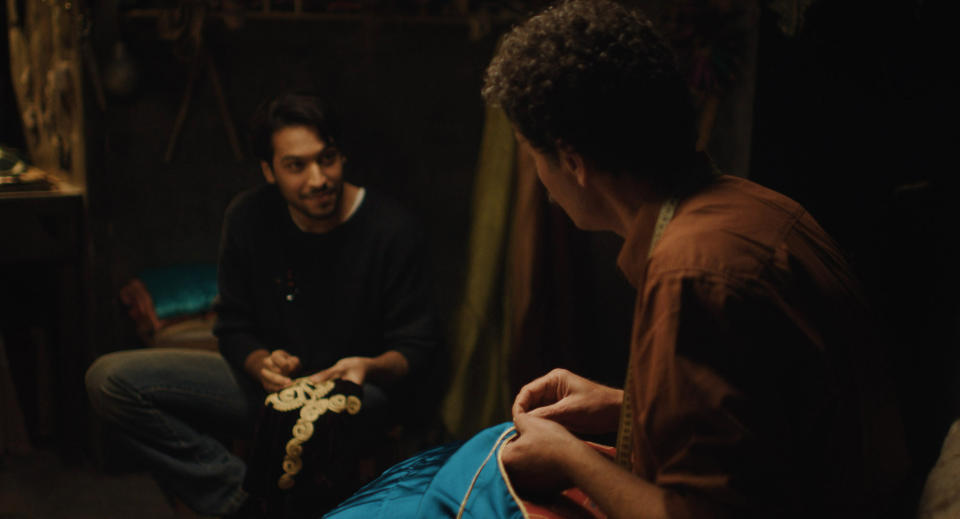 This image released by Strand Releasing shows Ayoub Missioui, left, and Saleh Bakri in a scene from "The Blue Caftan" directed by Maryam Touzani. (Strand Releasing via AP)