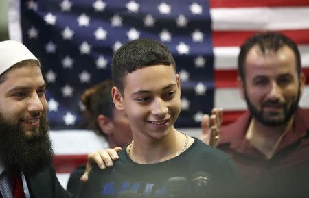 Florida teenager Tariq Khdeir (C), 15, is greeted by family members after his arrival from Israel at Tampa airport, Florida July 16, 2014. REUTERS/Scott Audette