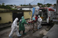 Emergency workers transfer an elderly patient, suspected of having COVID-19, to a hospital in Manaus, Brazil, Wednesday, May 13, 2020. Per capita, Manaus is Brazil's major city hardest hit by COVID-19. (AP Photo/Felipe Dana)