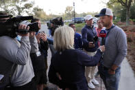 Bernd Wiesberger of Austria, right, is interviewed after the PGA tour canceled the rest of The Players Championship golf tournament as a result of the coronavirus pandemic, Friday, March 13, 2020, in Ponte Vedra Beach, Fla. (AP Photo/Lynne Sladky)