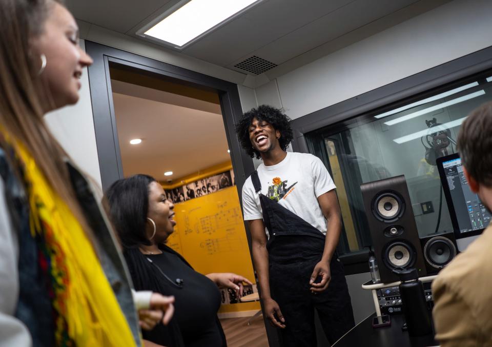 Tavion Knight, center, of Detroit rehearses a group number with Marissa Conniff, left, of Ypsilanti and Alaina Rose, center, of Detroit in the Hitsville Next building at Detroit's Motown Museum on Thursday, March 9, 2023, to be performed for the "Amplify" singing competition finale.