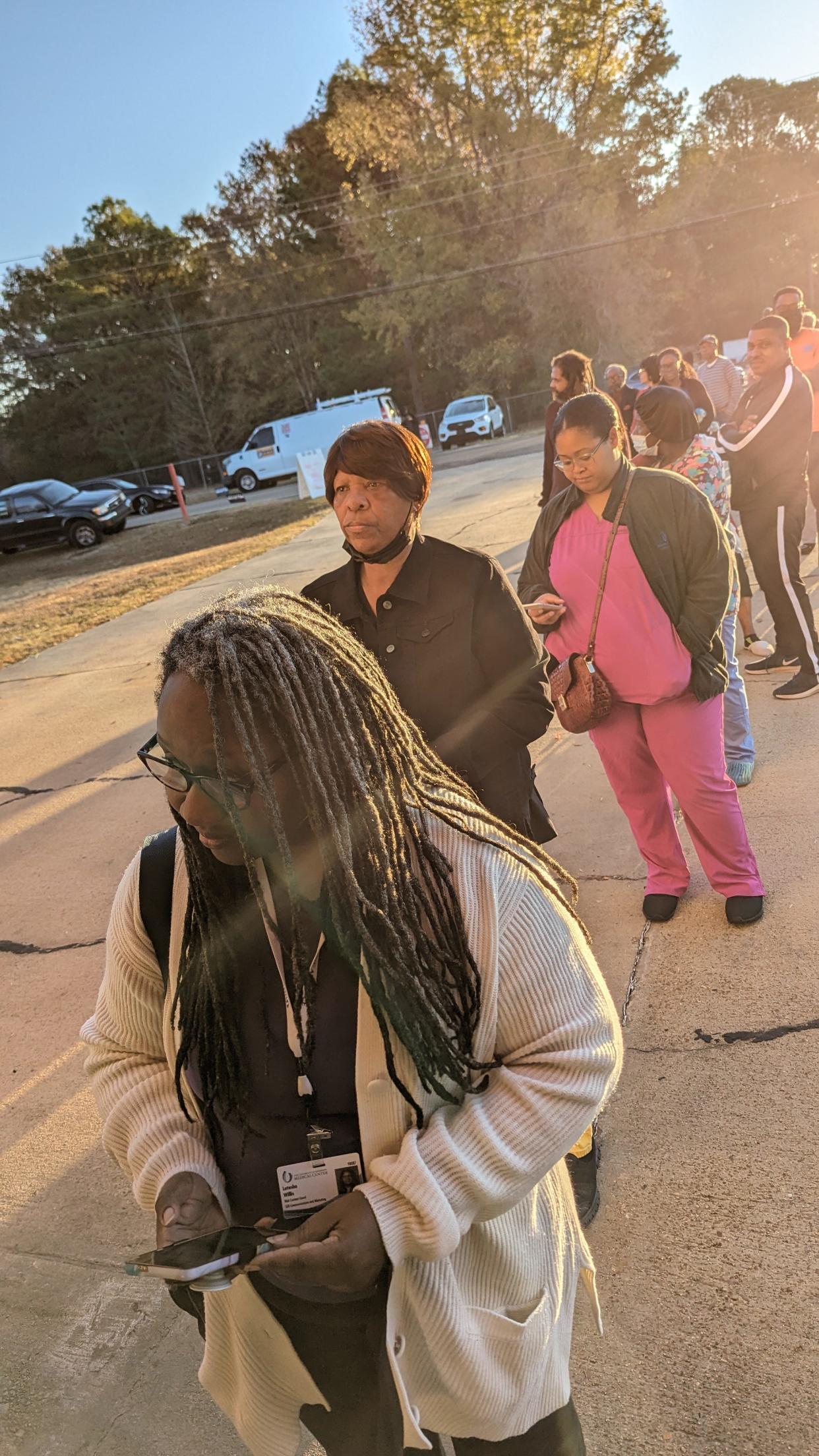 Latasha Willis of Jackson is the first in line to vote at Precinct 85 in Jackson Fire Station 26 on Flag Chapel Road on Tuesday.