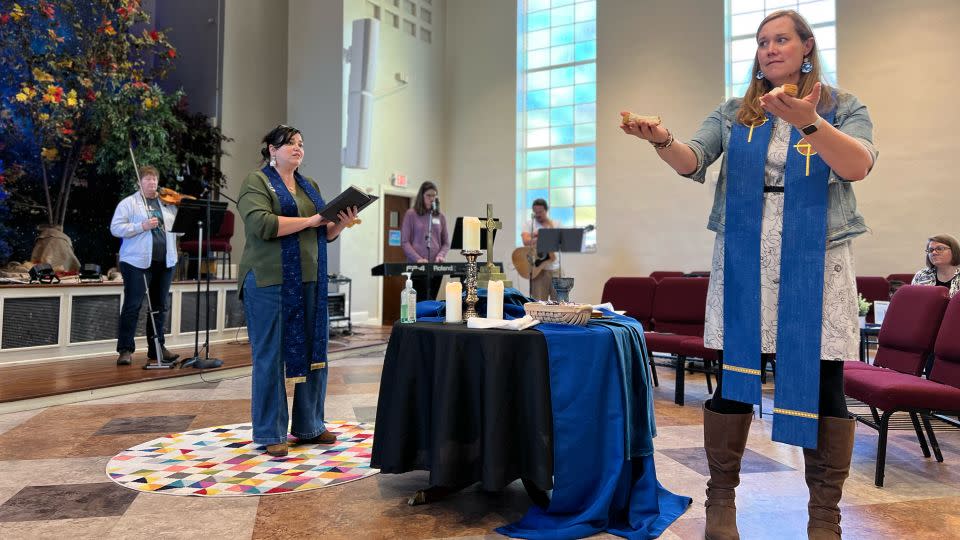 Rev. Anjie Woodworth, left, and Rev. Andi Woodworth during a service at the Neighborhood Church in Atlanta. - Courtesy Neighborhood Church Atlanta