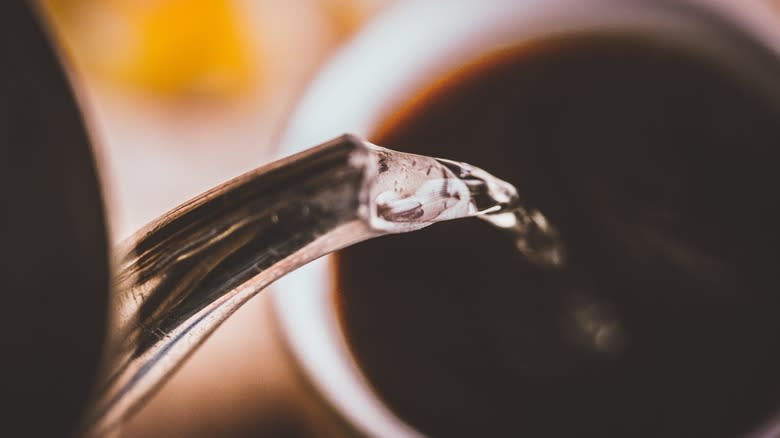 Pouring water into coffee pour-over