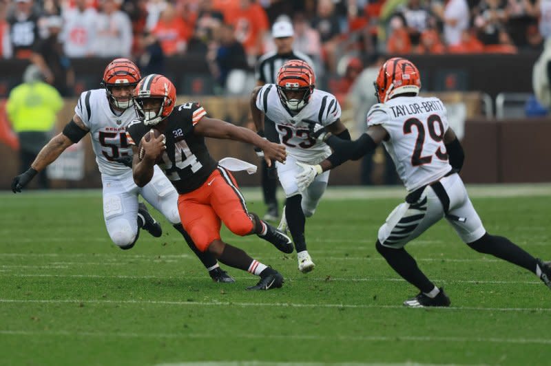 Cleveland Browns running back Nick Chubb (24) runs through Cincinnati Bengals defenders Sunday in Cleveland. Photo by Aaron Josefczyk/UPI