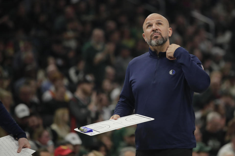 Dallas Mavericks head coach Jason Kidd looks up during a timeout during the first half of an NBA basketball game against the Milwaukee Bucks, Sunday, April 3, 2022, in Milwaukee. (AP Photo/Aaron Gash)