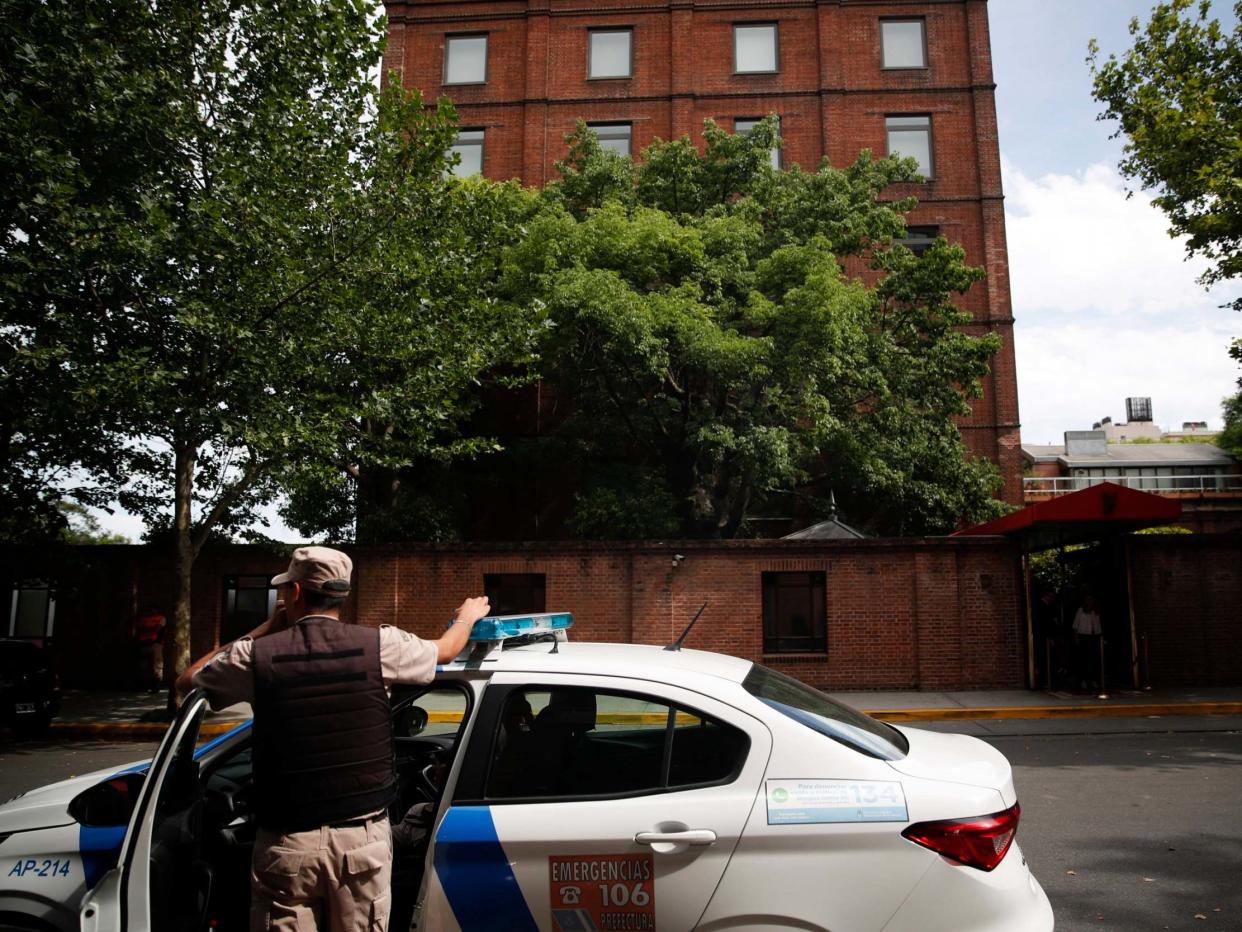 A police officer stands in front of the Faena Art Hotel in Buenos Aires, hours after Saturday's attack: AP