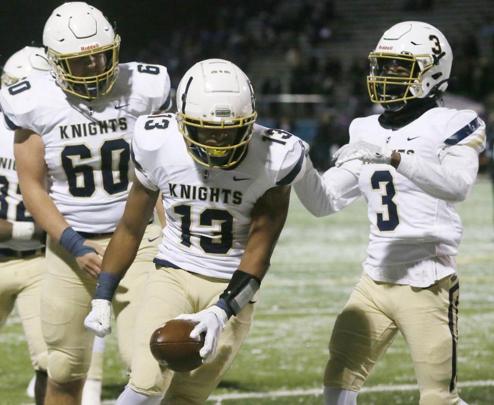 Archbishop Hoban's Shawn Parnell celebrates a touchdown reception in Division II state semifinal football game against Avon at Byers Field in Parma.  Hoban beat Avon 31 to 24.