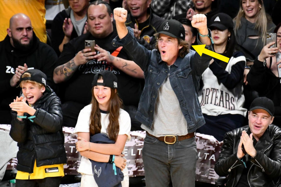 Jason Bateman cheering at a sports game