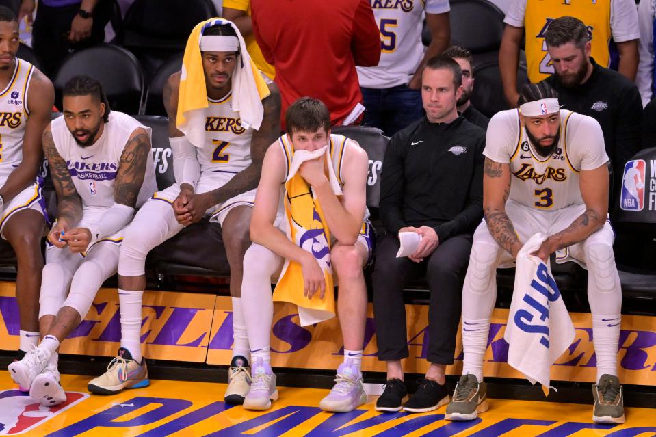 Los Angeles Lakers forward Jarred Vanderbilt (2) and guard Austin Reaves (15) and forward Anthony Davis (3) react in the fourth quarter against the Denver Nuggets during Game 3 of the Western Conference Finals.