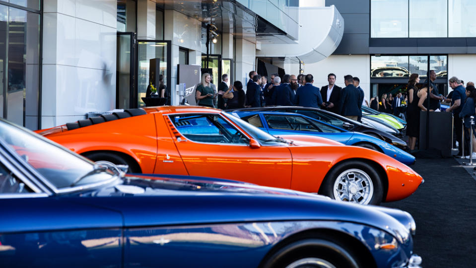 A lineup of iconic 12-cylinder Raging Bulls on display at the grand opening of the new showroom for Lamborghini Newport Beach.