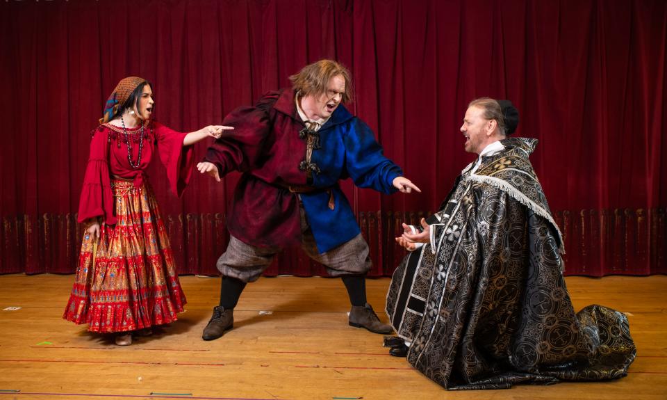 Alanis Sophia and Ben Gulley confront Kevin Anderson in "The Hunchback of Notre Dame," staged by Skylight Music Theatre.