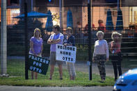 <p>Local residents hold signs of support to welcome home Otto Warmbier at Lunken Airport in Cincinnati, Ohio, June 13, 2017. (Photo: Bryan Woolston/Reuters) </p>