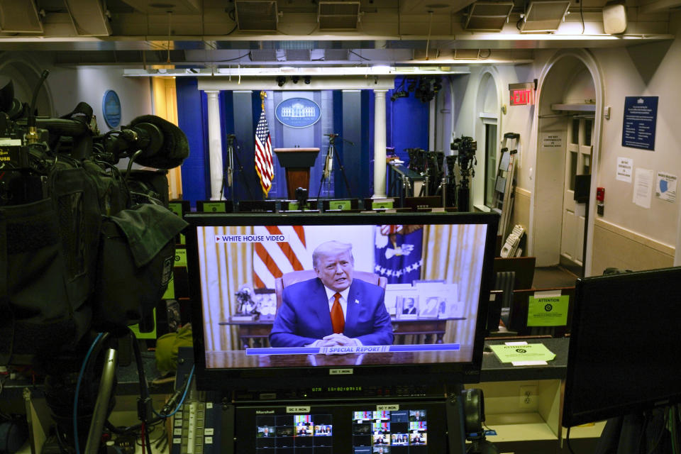 A video released by the White House, President Donald Trump shows a Twitter video on a television monitor in an empty press briefing room at the White House in Washington, after the U.S. House impeached him, Wednesday, Jan. 13, 2021. The pre-recorded video was being broadcast by Fox News. (AP Photo/Gerald Herbert )