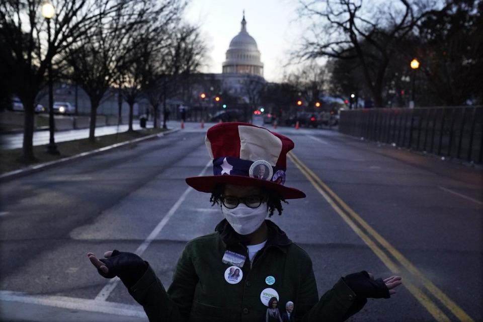 Washington: Teri McClain, of Seattle, poses near the Capitol Building ahead of President-elect Joe Bidens inauguration ceremony.